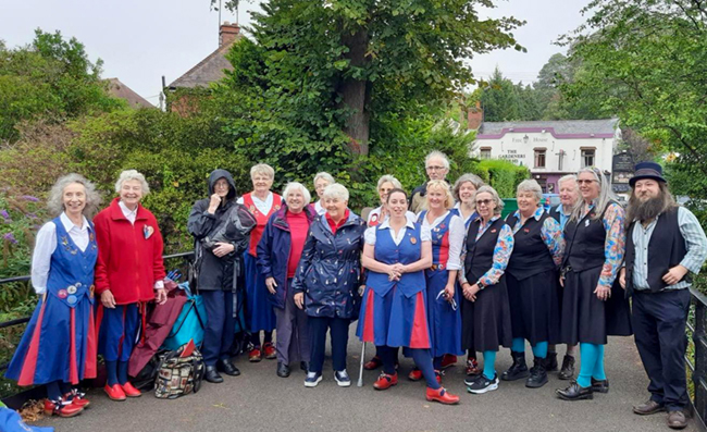 Group photo of Butterfly and Castle Clog members - rain is in the air.