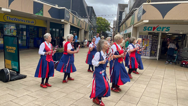 The Butterflies dancing in St Andrews Square Droitwich surrounded by shops.