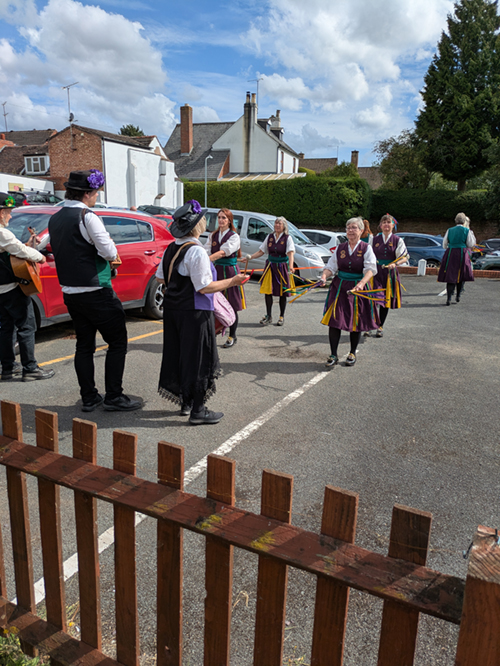 Belle D'vain in their purple and yellow 'plum' coloured oufits in action.