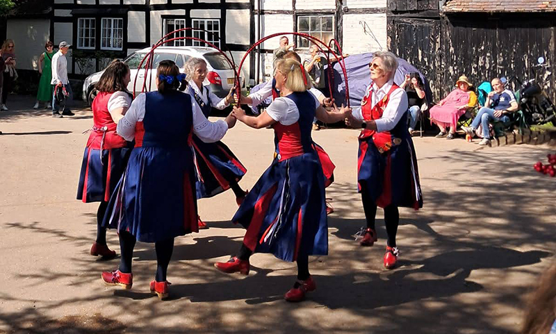 nancy butterfly dancing in a circle with hoops