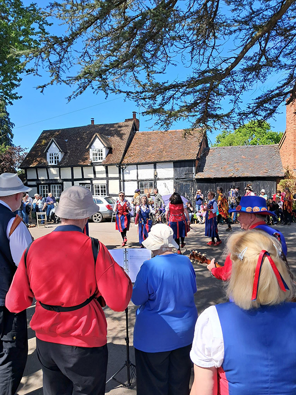 looking at nancy butterfly dancing viewed from behind members of the band
