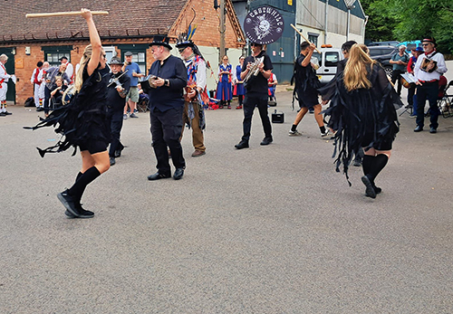 Erstwhile Border Morris in their black kit in full flow