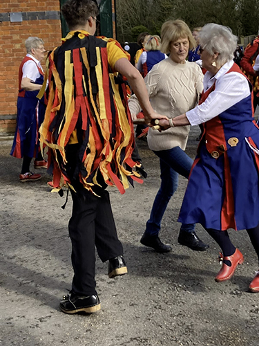 one Butterfly dancer, one blackadder dancer and one visitor dancing in a 'have a go session'