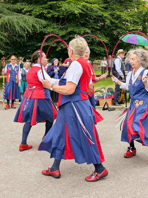 3 Butterfly dancers holding hoops