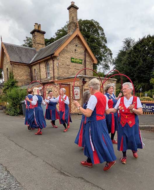 Dancing in Arley station yard in front of the Station buildings